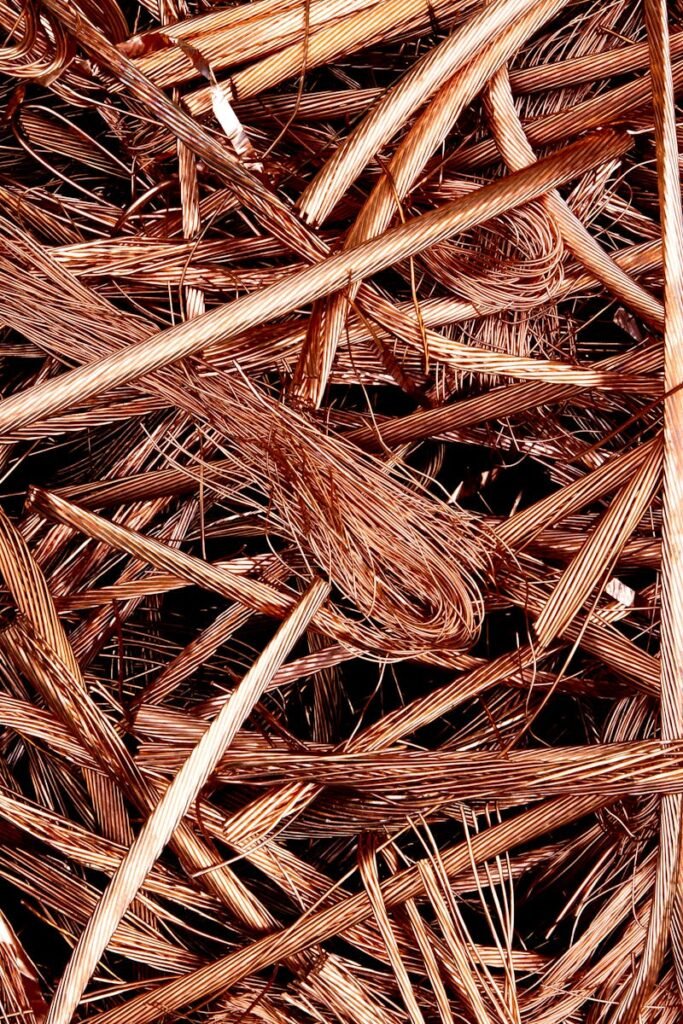 Close-up view of intertwined copper wires ready for recycling, emphasizing industrial reuse.